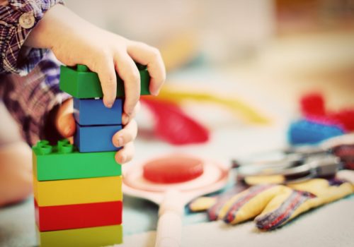 child playing with best toys for speech and language