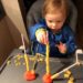 toddler threading pasta for fine motor and language development
