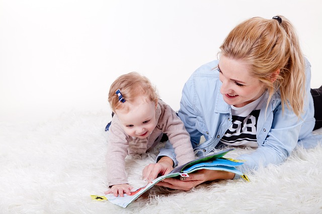 Mother reading with baby to encourage language development