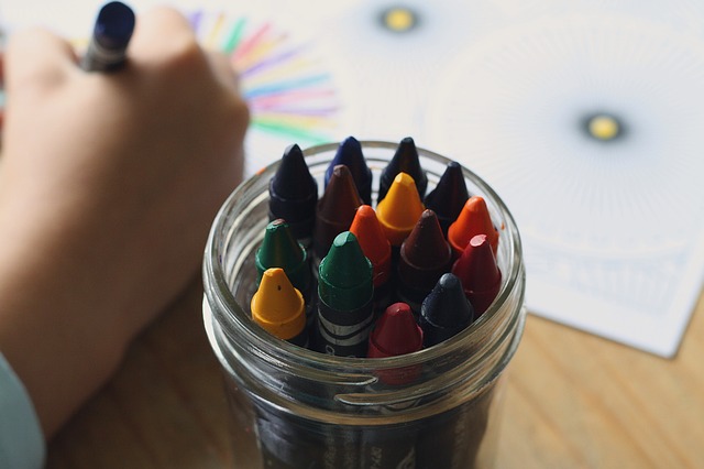 child coloring a mystery craft for speech therapy