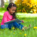 picture of girl reading spring books for speech therapy